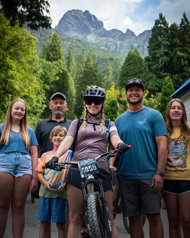 Mountain bike racer with supporting family