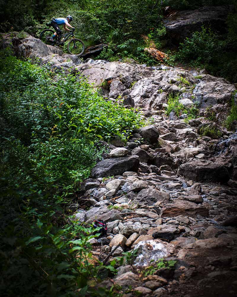 mountain bike racer riding the waterfall