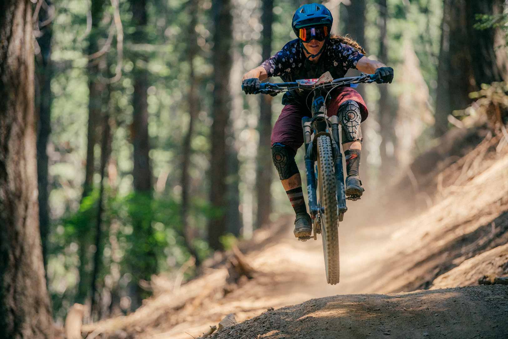 Racer catching air on Third Divide Trail