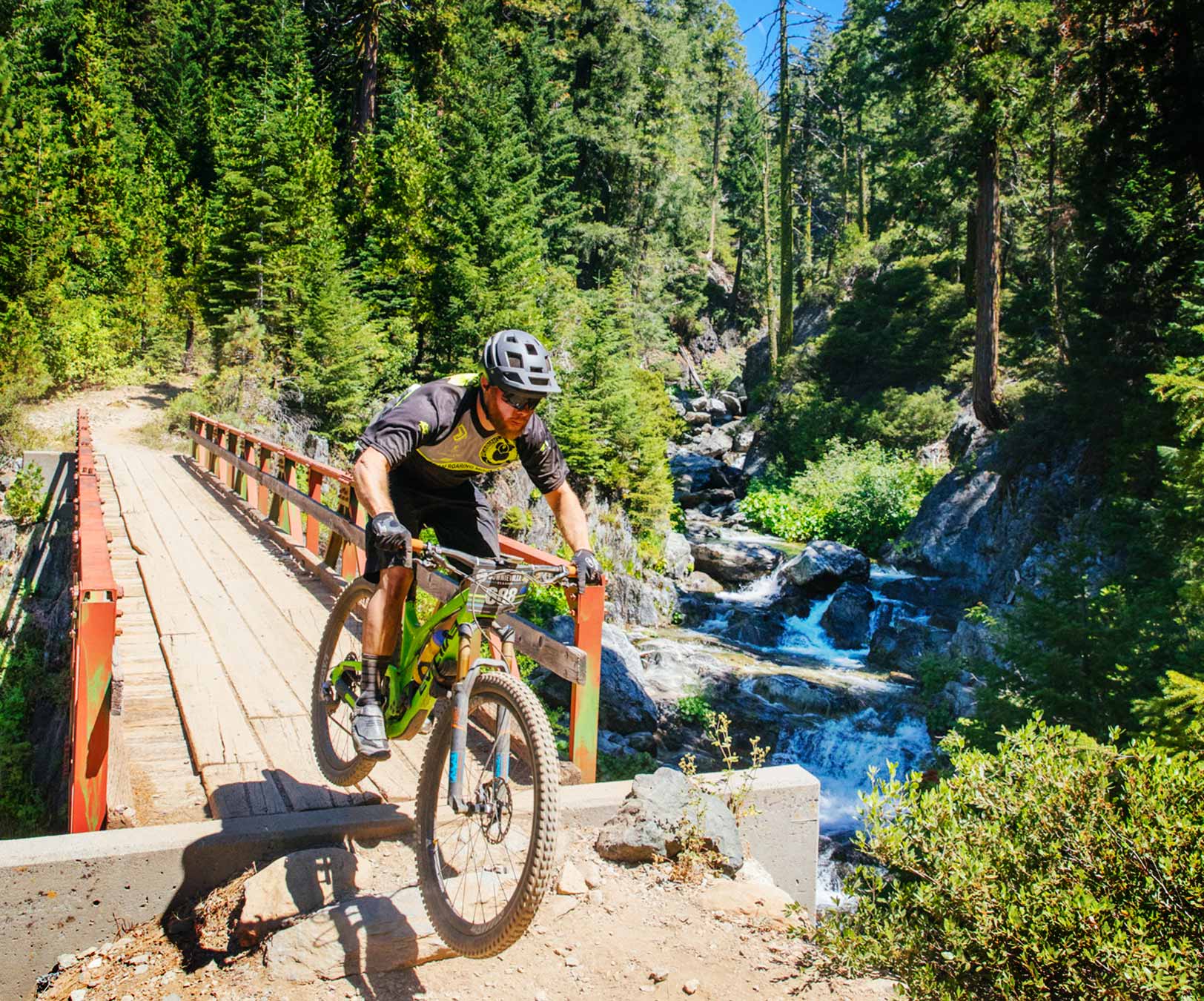 racer crossing Pauly Creek bridge